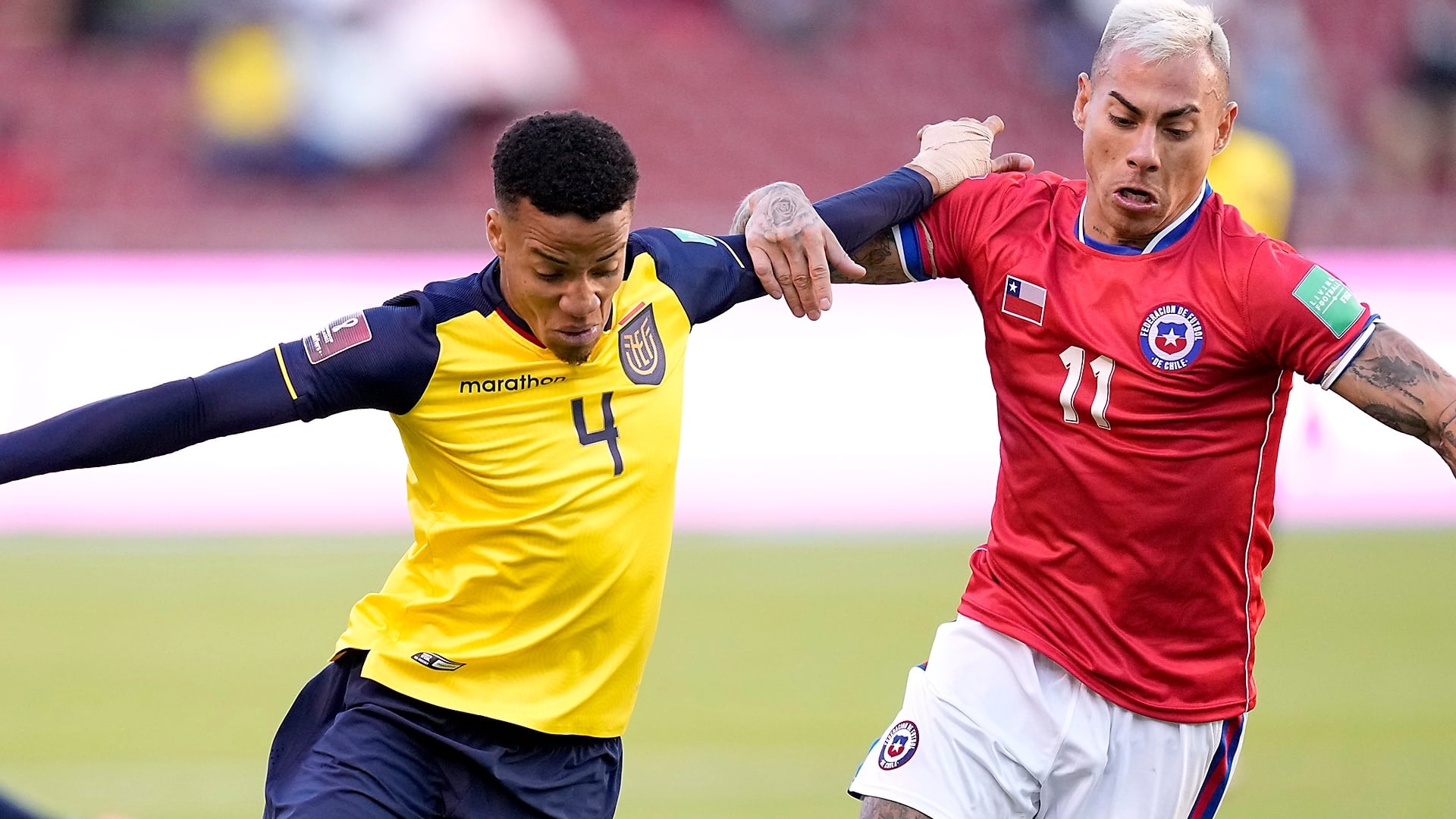 QUITO, ECUADOR - SEPTEMBER 05: Byron Castillo (C) of Ecuador competes for the ball with Eduardo Vargas (R) of Chile during a match between Ecuador and Chile as part of South American Qualifiers for Qatar 2022 at Rodrigo Paz Delgado Stadium on September 05, 2021 in Quito, Ecuador. (Photo by Dolores Ochoa - Pool/Getty Images)