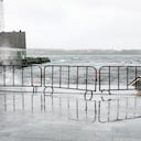 A barricade keeps people away from the crashing waves at the Queen's Marque in Halifax, Nova Scotia, on Saturday, Sept. 16, 2023. Severe conditions were predicted across parts of Massachusetts and Maine, and hurricane conditions could hit the Canadian provinces of New Brunswick and Nova Scotia, where the storm, Lee, downgraded early Saturday from hurricane to post-tropical cyclone, was expected to make landfall later in the day. (Kelly Clark /The Canadian Press via AP)