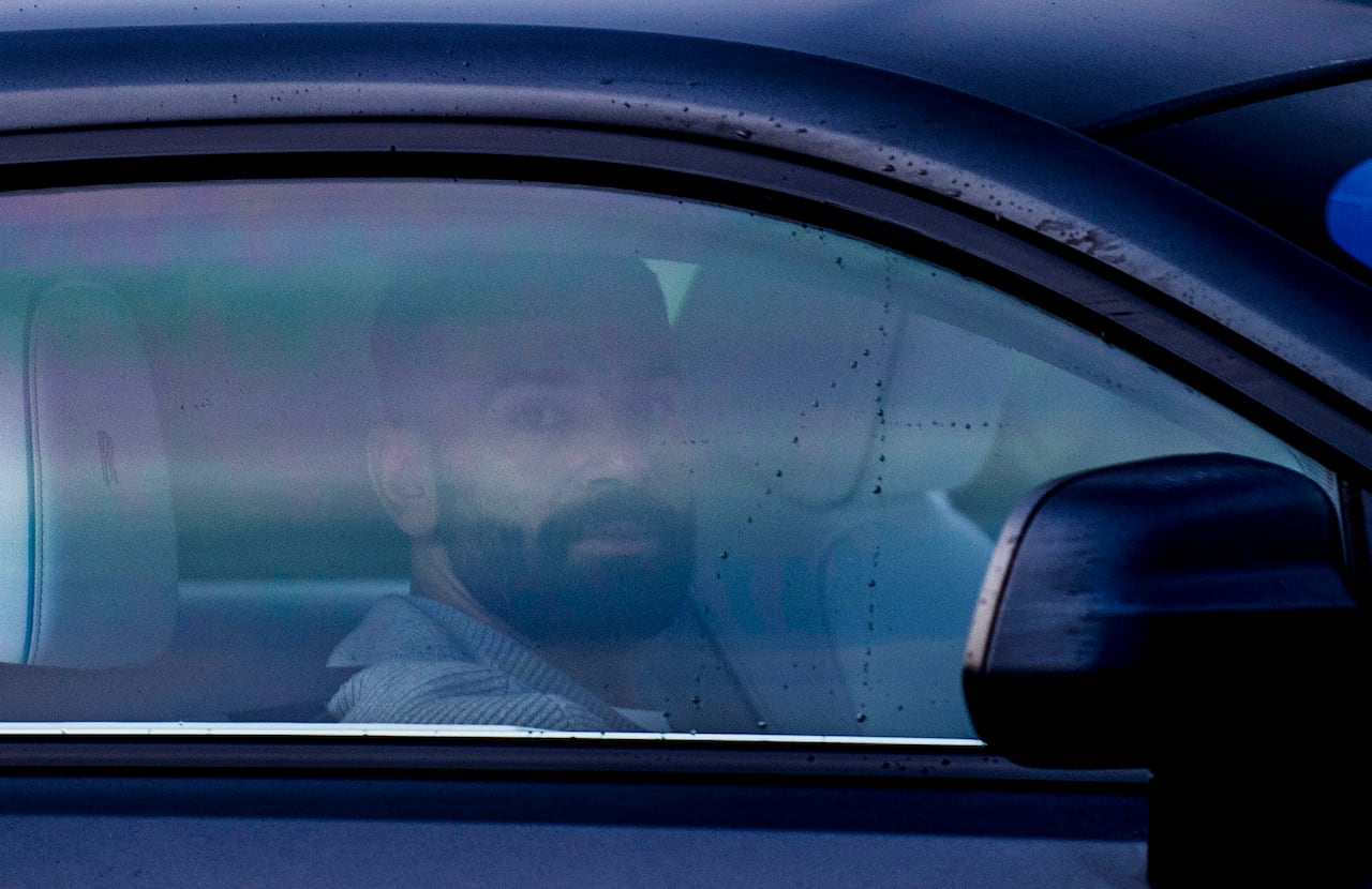 Liverpool's Egyptian striker #11 Mohamed Salah drives his car as he arrives at Liverpool's Axa training facility in Kirkby, north-west England on December 9, 2025, the morning the rest of his team are set to play a UEFA Champions League league phase football match against Inter Milan in Milan. Former Liverpool defender Jamie Carragher labelled Mohamed Salah "a disgrace" on December 8, 2025 after the Egypt star's stunning outburst at Reds boss Arne Slot. Salah said he had been "thrown under a bus" and had no relationship with Slot after he was left on the bench for last Saturday's 3-3 draw at Leeds. (Photo by Peter Powell / AFP)