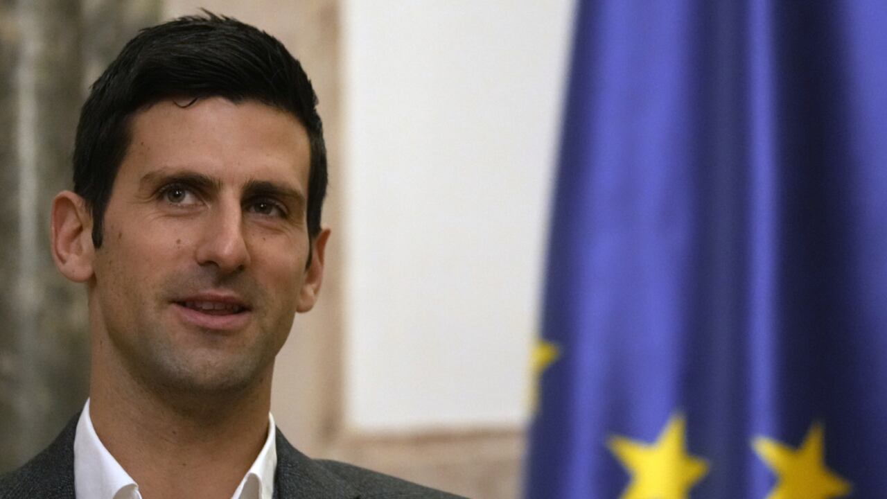 Serbian tennis player Novak Djokovic, left, speaks with Serbia's President Aleksandar Vucic in Belgrade, Serbia, Thursday, Feb. 3, 2022. Serbia's state prosecutors have rejected suggestions that Novak Djokovic used a fake positive test for COVID-19 to try to enter Australia and compete in the Australian Open. (AP/Darko Vojinovic)