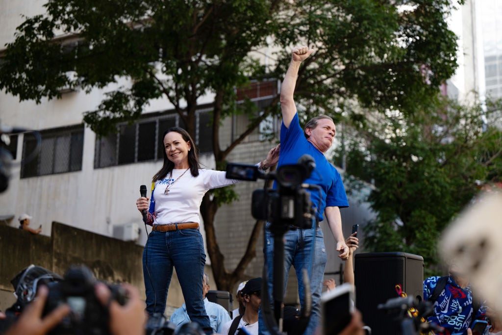 CARACAS, VENEZUELA - JANUARY 9: Opposition Leader Maria Corina Machado and Juan Pablo Guanipa participate during an anti-government protest on January 9, 2025 in Caracas, Venezuela. According to information shared by the Vente Venezuela Party, Machado was intercepted by government forces deployed by president Nicolas Maduro after finishing her participation in the rally. (Photo by Alfredo Lasry R/Getty Images)