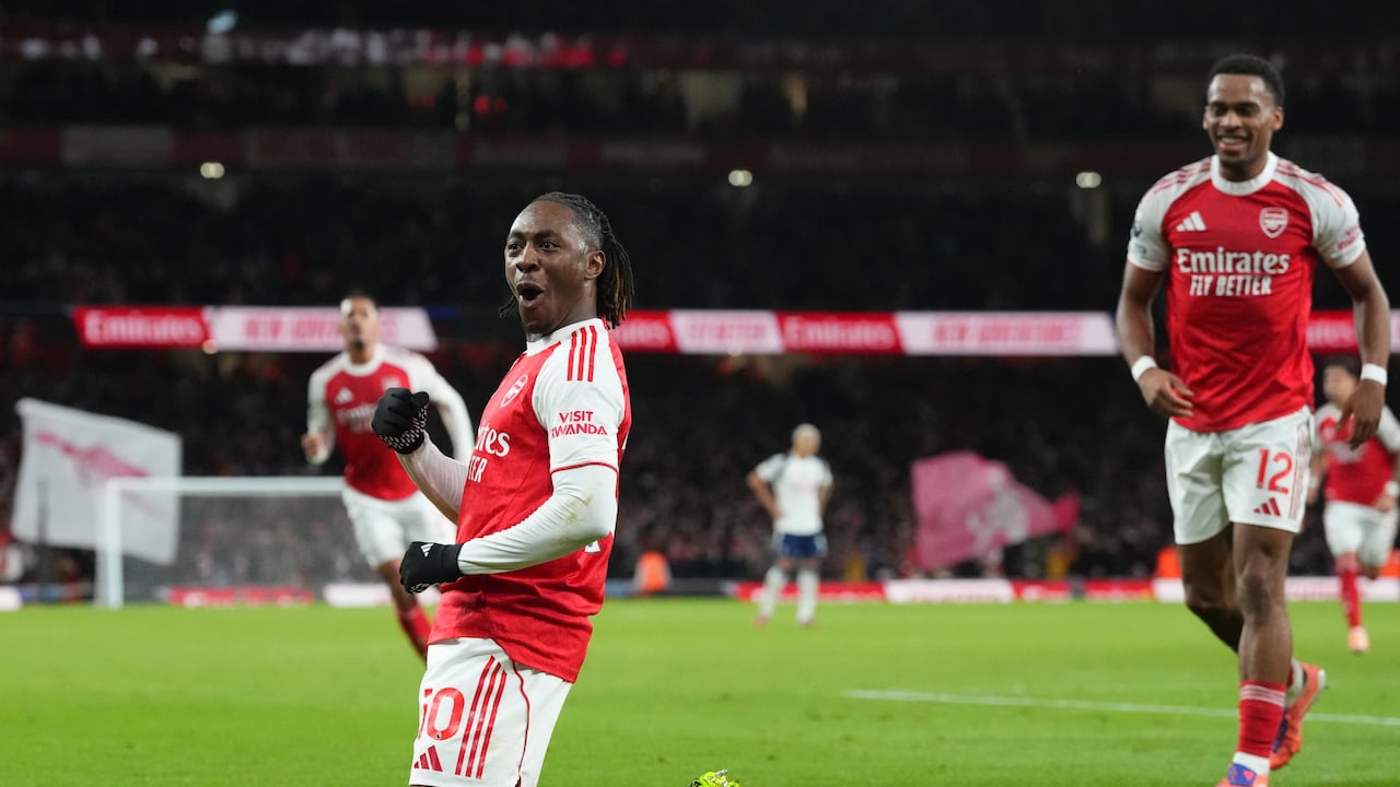 Arsenal's Eberechi Eze celebrates after scoring during a Premier League soccer match between Arsenal and Tottenham in London, Sunday, Nov. 23, 2025. (AP Photo/Frank Augstein)