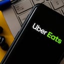 POLAND - 2020/10/20: In this photo illustration a Uber Eats logo seen displayed on a smartphone. (Photo Illustration by Mateusz Slodkowski/SOPA Images/LightRocket via Getty Images)