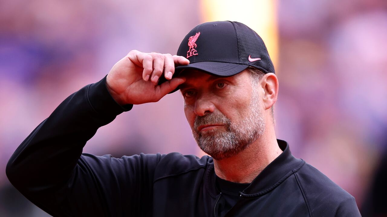 Liverpool's manager Jurgen Klopp takes off his hat before the English FA Cup final soccer match between Chelsea and Liverpool, at Wembley stadium, in London, Saturday, May 14, 2022. (AP Photo/Ian Walton)