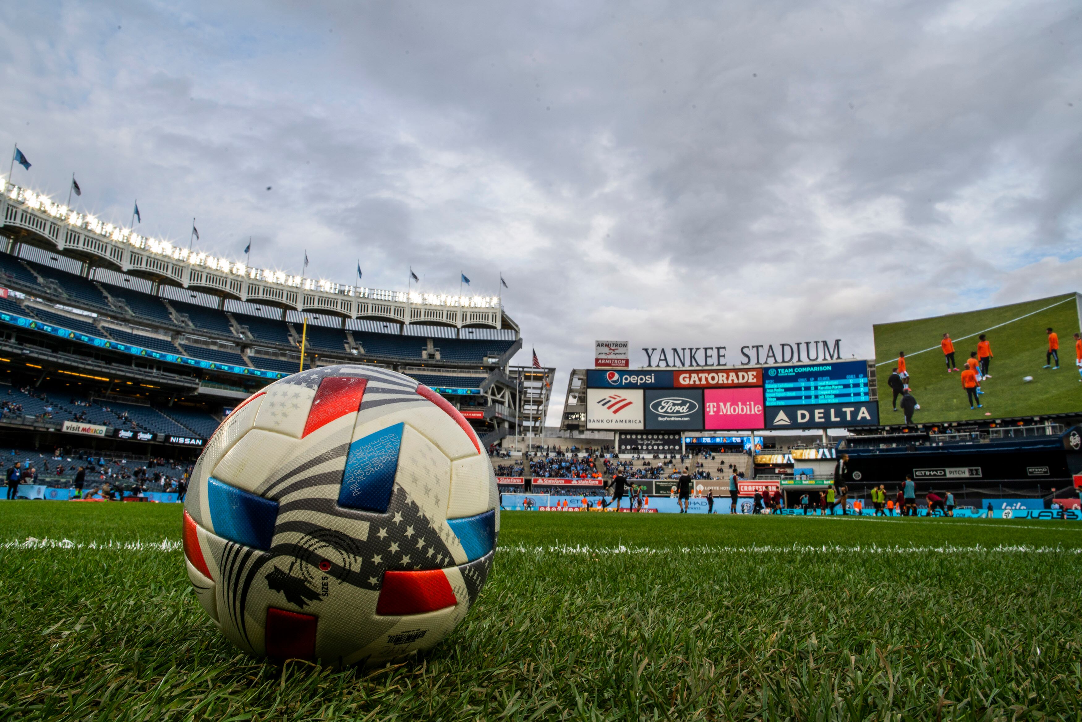 Players for New York City FC and Atlanta United warm up before an MLS soccer match at Yankee Stadium, Sunday, Nov. 21, 2021, in New York. (AP Photo/Eduardo Munoz Alvarez)