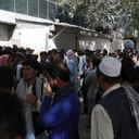 Afghans wait in long lines for hours to try to withdraw money, in front of Kabul Bank, in Kabul, Afghanistan, Sunday, Aug. 15, 2021. Officials say Taliban fighters have entered Kabul and are seeking the unconditional surrender of the central government. (AP Photo/Rahmat Gul)