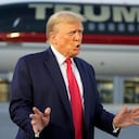 Former President Donald Trump speaks with reporters before departure from Hartsfield-Jackson Atlanta International Airport, Thursday, Aug. 24, 2023, in Atlanta. (AP Photo/Alex Brandon)