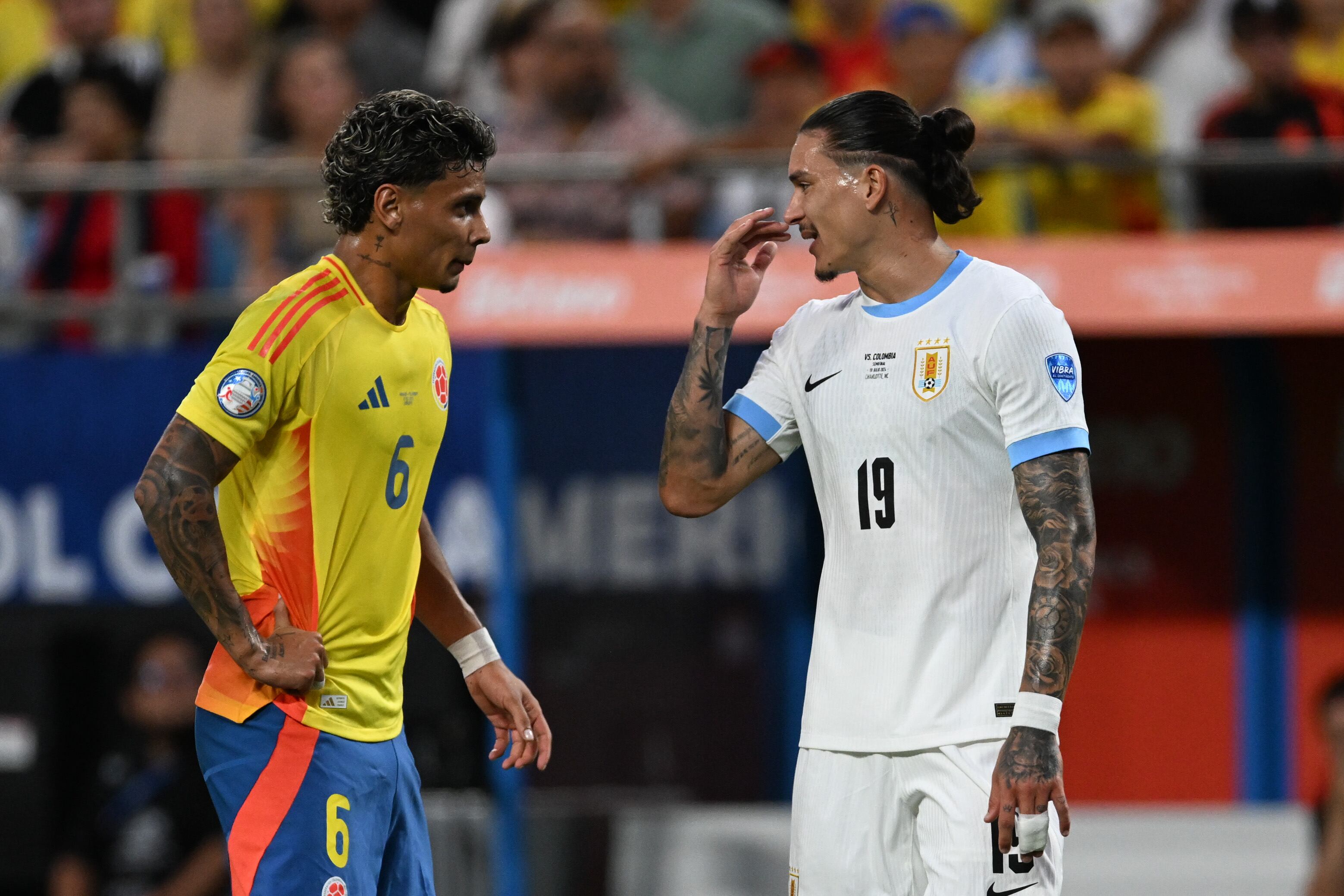 CHARLOTTE, NORTH CAROLINA - JULY 10: Darwin Nunez #19 of Uruguay talks with Richard Rios #6 of Colombia during the first half of the semi-final match between Uruguay and Colombia in the CONMEBOL Copa America USA 2024 at Bank of America Stadium on July 10, 2024 in Charlotte, North Carolina. (Photo by Robin Alam/ISI Photos/Getty Images)