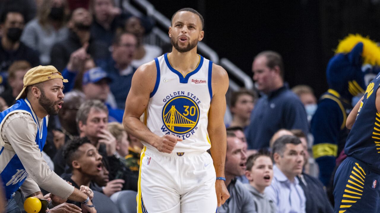 Golden State Warriors guard Stephen Curry (30) reacts after missing a three-point basket during the second half of an NBA basketball game against the Indiana Pacers in Indianapolis, Monday, Dec. 13, 2021. (AP/Doug McSchooler)