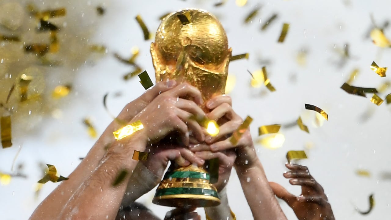 FILES) This file photo taken on July 15, 2018 France's players lifting the Fifa World Cup trophy after the Russia 2018 World Cup final football match between France and Croatia at the Luzhniki Stadium in Moscow. Four years after France's victory, football is waiting for its new master at the 2022 World Cup. But the contenders, Brazil, Argentina and France, are afraid of getting bogged down in the atypical World Cup in Qatar, which promises to be full of surprises.
AFP/Jewel SAMAD