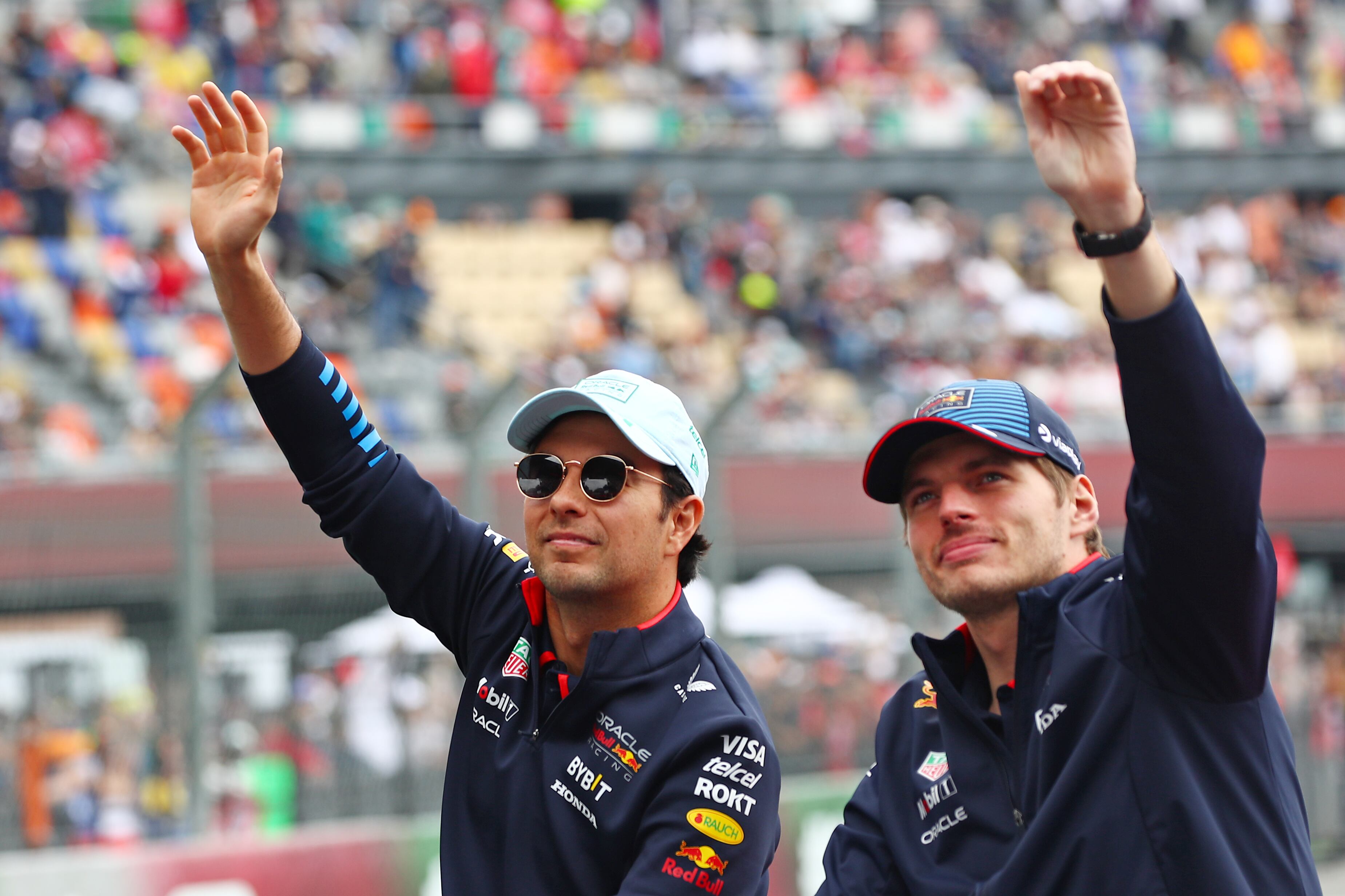 MEXICO CITY, MEXICO - OCTOBER 27: Sergio Perez of Mexico and Oracle Red Bull Racing and Max Verstappen of the Netherlands and Oracle Red Bull Racing wave to the crowd on the drivers parade prior to the F1 Grand Prix of Mexico at Autodromo Hermanos Rodriguez on October 27, 2024 in Mexico City, Mexico. (Photo by Peter Fox - Formula 1/Formula 1 via Getty Images)