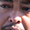 Mass shooting survivor Wilson Garcia sheds a tear as he talks about his wife and son, who were killed in Friday's shooting, Sunday, April 30, 2023, at a vigil for his son in Cleveland, Texas. The search for a Texas man who allegedly shot his neighbors after they asked him to stop firing off rounds in his yard stretched into a second day Sunday, with authorities saying the man could be anywhere by now. The suspect fled after the shooting Friday night that left multiple people dead. (AP Photo/David J. Phillip)