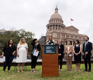 FILE - Amanda Zurawski, one of five plaintiffs, speaks in front of the state Capitol in Austin, Texas, March 7, 2023, as the Center for Reproductive Rights and the plaintiffs announced their lawsuit, which asks for clarity in Texas law as to when abortions can be provided under the "medical emergency" exception. All five women were denied medical care while experiencing pregnancy complications that threatened their health and lives. The women are headed to court Wednesday, July 19, as legal challenges to abortion bans across the U.S. continue a year after the fall of Roe v. Wade. (Sara Diggins/Austin American-Statesman via AP, File)
