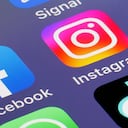 PARIS, FRANCE - FEBRUARY 20: In this photo illustration, the logos of social media applications, Facebook and Instagram are displayed on the screen of an iPhone on February 20, 2023 in Paris, France. Meta CEO Mark Zuckerberg announced on Sunday the launch of a paid subscription starting at $11.99 per month for users to authenticate their accounts on Meta platforms (Facebook, Instagram). The subscription will first roll out in Australia and New Zealand this week and resembles Twitter's model. (Photo illustration by Chesnot/Getty Images)