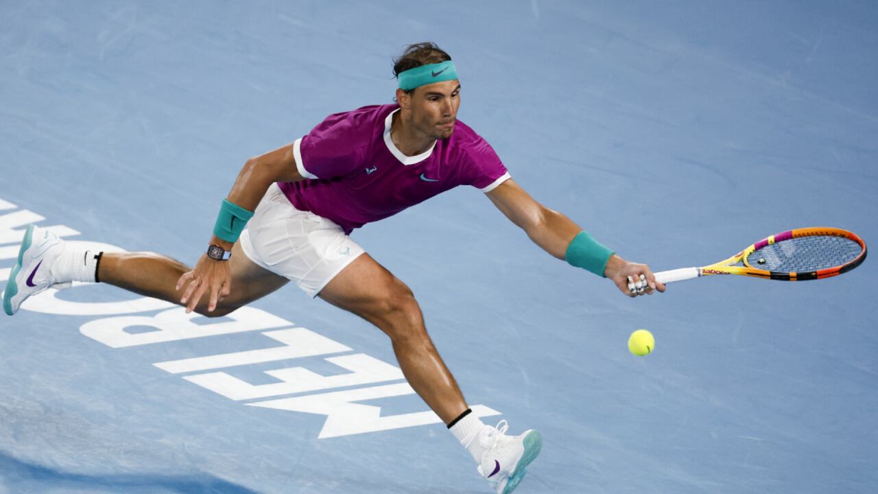 Rafael Nadal of Spain plays a forehand return to Karen Khachanov of Russia during their third round match at the Australian Open tennis championships in Melbourne, Australia, Friday, Jan. 21, 2022. (AP/Hamish Blair)