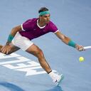 Rafael Nadal of Spain plays a forehand return to Karen Khachanov of Russia during their third round match at the Australian Open tennis championships in Melbourne, Australia, Friday, Jan. 21, 2022. (AP Photo/Hamish Blair)