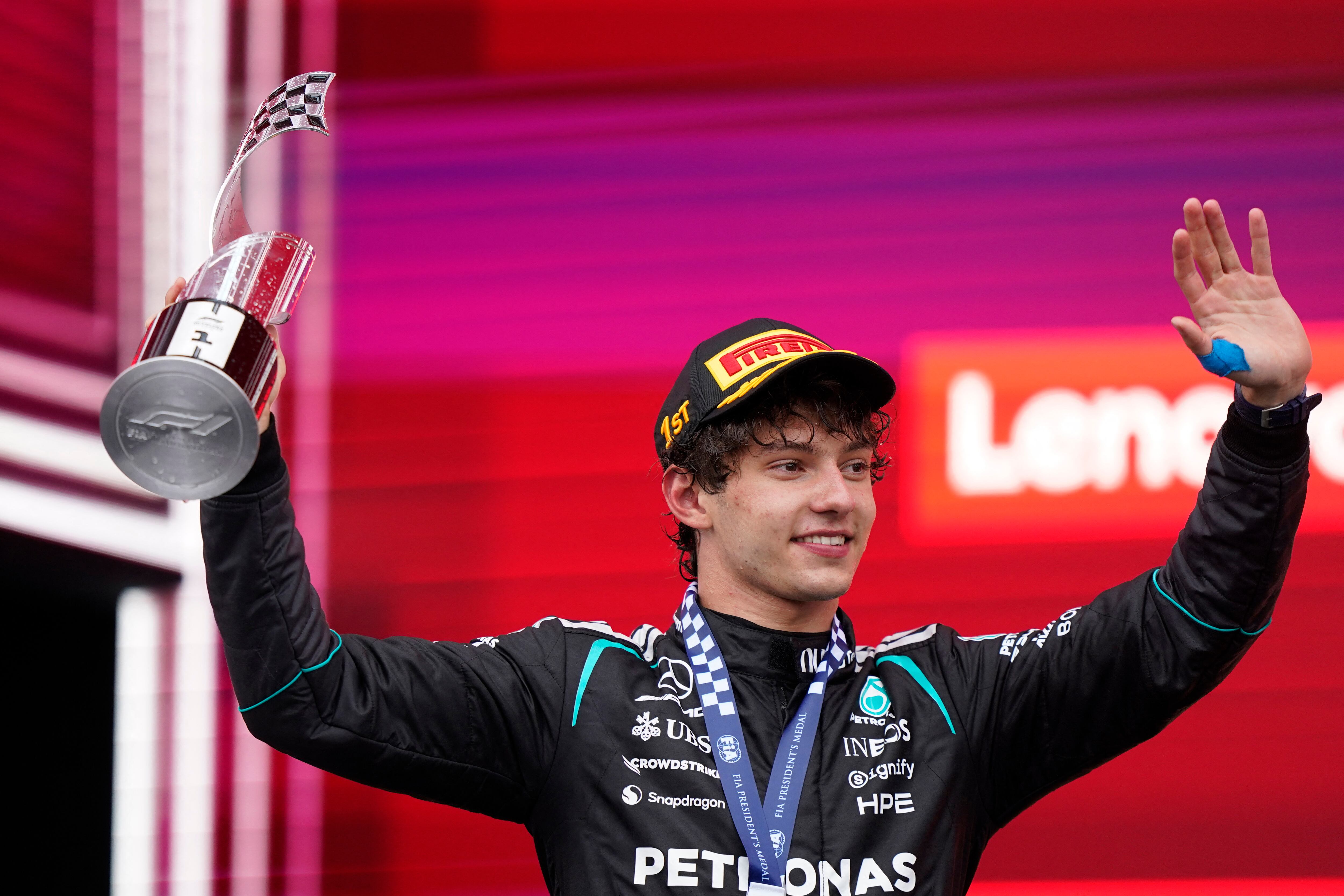 Mercedes' Italian driver Kimi Antonelli raises the trophy while celebrating on the podium his victory in the 2026 Formula 1 Grand Prix du Canada at Circuit Gilles-Villeneuve in Montreal, Canada, on May 24, 2026. (Photo by Geoff Robins / AFP)