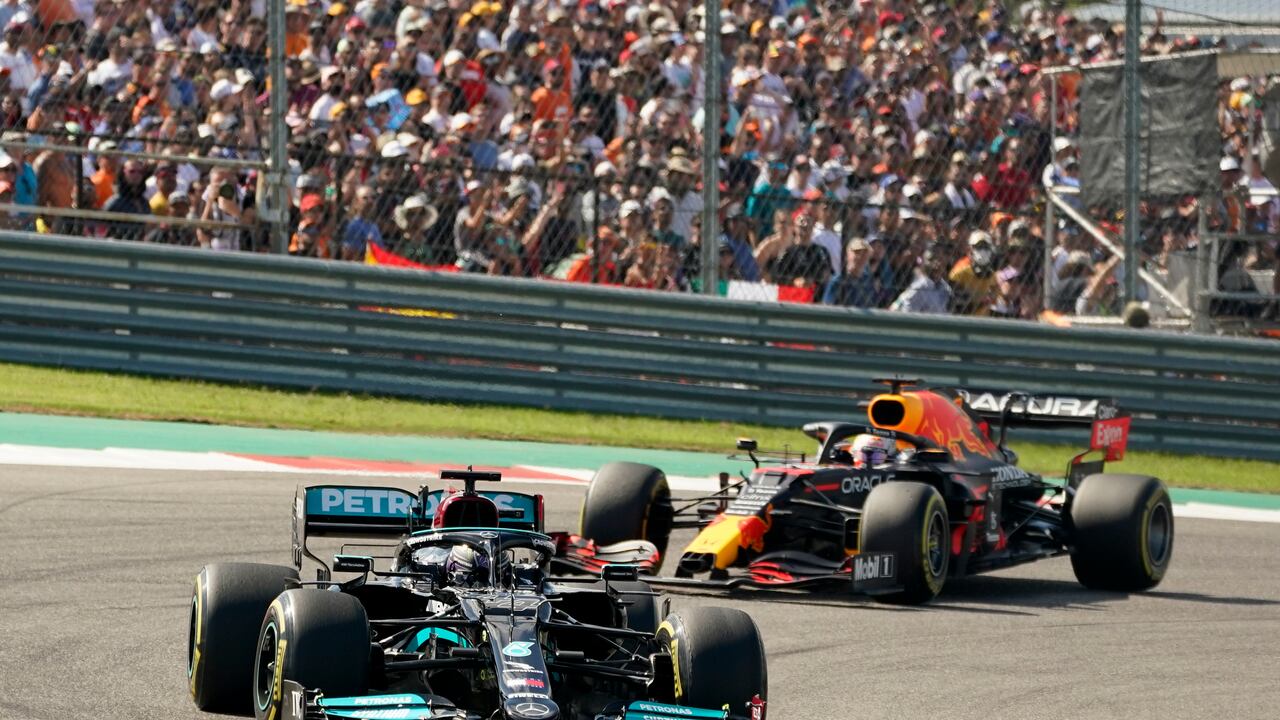 Mercedes driver Lewis Hamilton, of Britain, leads Red Bull driver Max Verstappen, of the Netherlands, during the Formula One U.S. Grand Prix auto race at the Circuit of the Americas, Sunday, Oct. 24, 2021, in Austin, Texas. (AP Photo/Eric Gay)