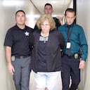 This image taken from video provided by the Marion County Sheriff’s Office shows Susan Lorincz, center, after her arrest in Ocala, Fla., Tuesday, June 6, 2023. Lorincz is accused of fatally shooting her neighbor, Ajike Owens, a Black mother of four. (Marion County Sheriff’s Office via AP)