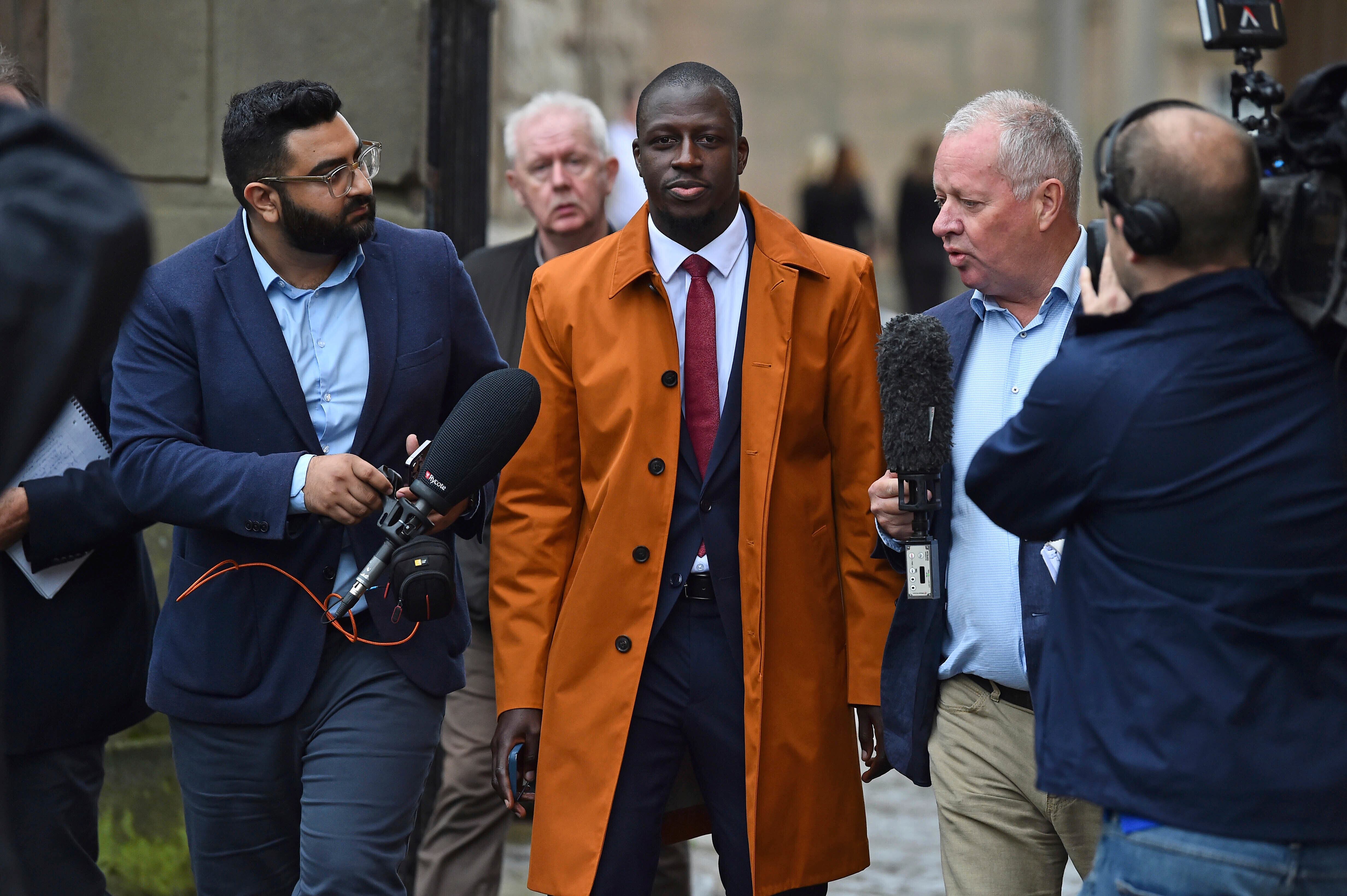 Former Manchester City footballer Benjamin Mendy, left, walks outside Chester Crown Court, where he is appearing accused of rape and attempted rape, in Chester, England, Friday July 14, 2023. (Peter Powell/PA via AP)