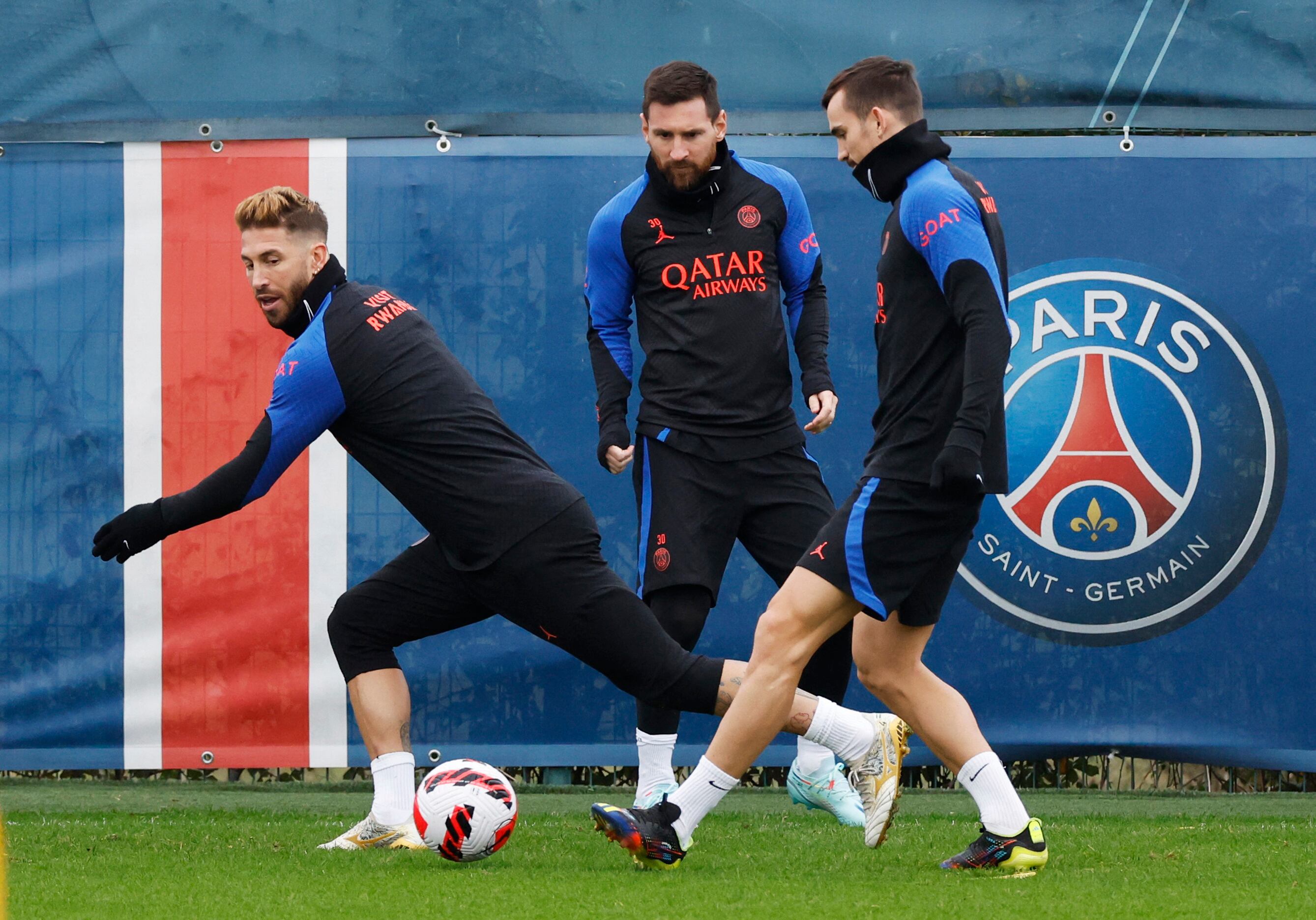 Soccer Football - Coupe de France - Paris St Germain Training - Ooredoo Training Centre, Saint-Germain-en-Laye, France - January 5, 2023 Paris St Germain's Lionel Messi with Sergio Ramos and Fabian Ruiz during training REUTERS/Gonzalo Fuentes