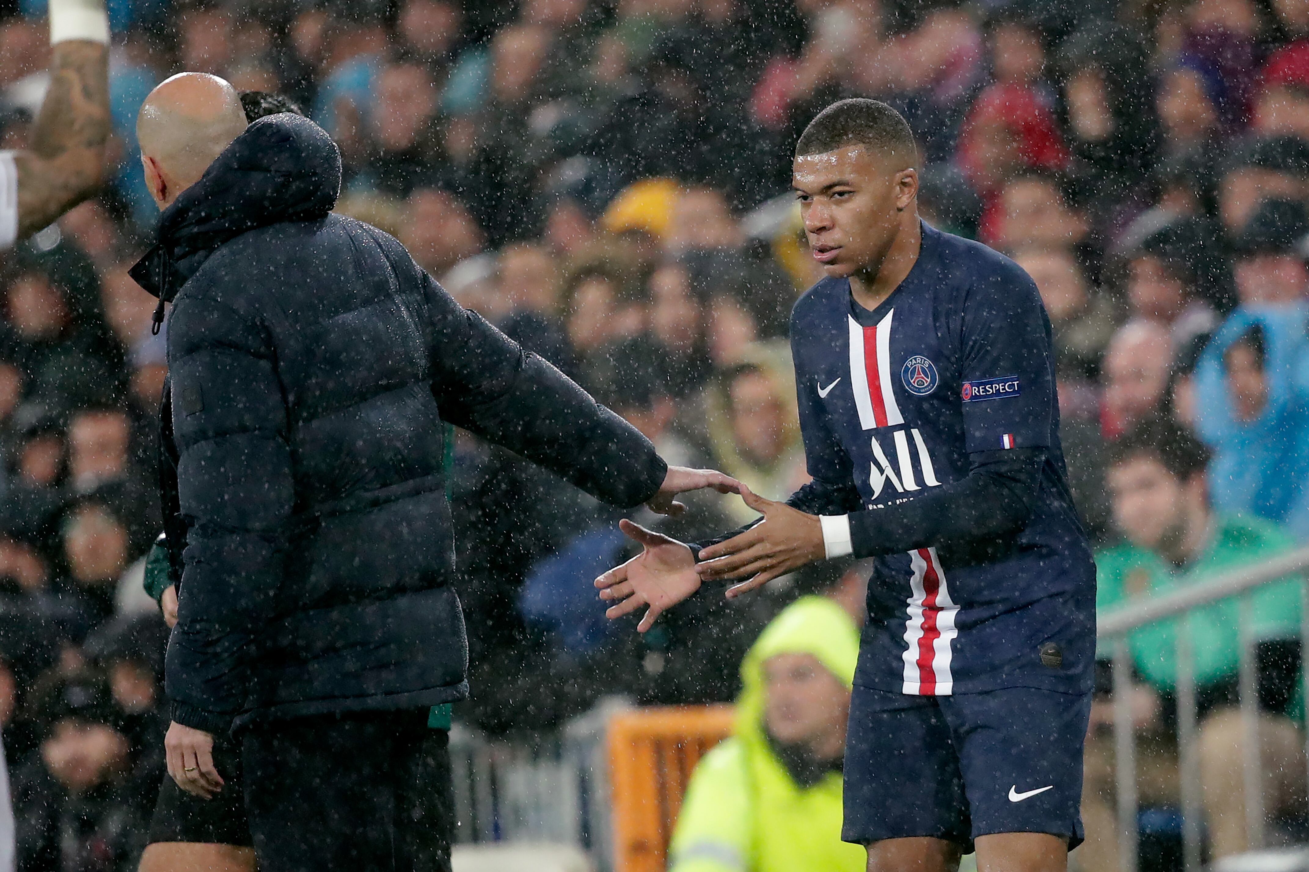 MADRID, SPAIN - NOVEMBER 26: (L-R) coach Zinedine Zidane of Real Madrid, Kylian Mbappe of Paris Saint Germain 
 during the UEFA Champions League  match between Real Madrid v Paris Saint Germain at the Santiago Bernabeu on November 26, 2019 in Madrid Spain (Photo by David S. Bustamante/Soccrates/Getty Images)