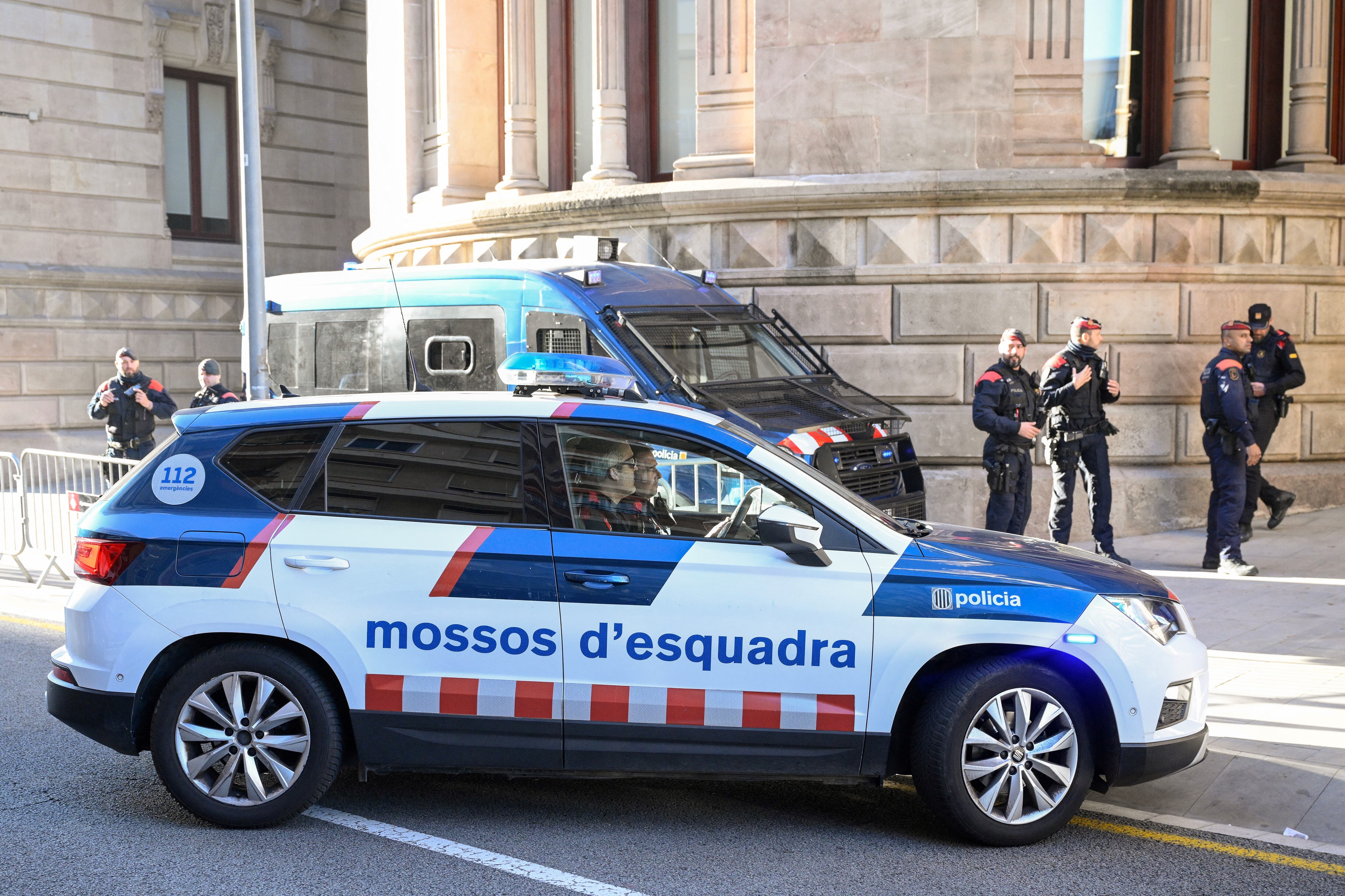 A car of the Catalan regional police forces Mossos d'Esquadra arrives at the High Court of Justice of Catalonia, ahead of the start of Brazilian footballer Dani Alves' trial in Barcelona, on February 5, 2024. Brazilian footballer Dani Alves, a former star at Barca and PSG, goes on trial in Barcelona accused of raping a woman in a local nightclub. Prosecutors are asking for a nine-year prison sentence, followed by 10 years of conditional liberty. They are also asking he pay 150,000 euros ($162,000) in compensation to the woman. (Photo by Josep LAGO / AFP)
