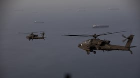 This handout photo released by US Central Command via their X account (@CENTCOM) on April 18, 2026 shows AH-64 Apaches flying above the Strait of Hormuz during a patrol on April 17, 2026. Iran's military declared the Strait of Hormuz closed again on April 18, prompting ships to abandon attempts to transit and President Donald Trump to warn Tehran against trying to "blackmail" the United States. On April 17, Tehran had declared the strait, which usually carries a fifth of the world's oil and liquefied natural gas, open after a ceasefire was agreed in Israel's war with Iran's ally Hezbollah in Lebanon. (Photo by US Central Command (CENTCOM) / AFP) / RESTRICTED TO EDITORIAL USE - MANDATORY CREDIT "AFP PHOTO / US CENTRAL COMMAND " - HANDOUT - NO MARKETING NO ADVERTISING CAMPAIGNS - DISTRIBUTED AS A SERVICE TO CLIENTS