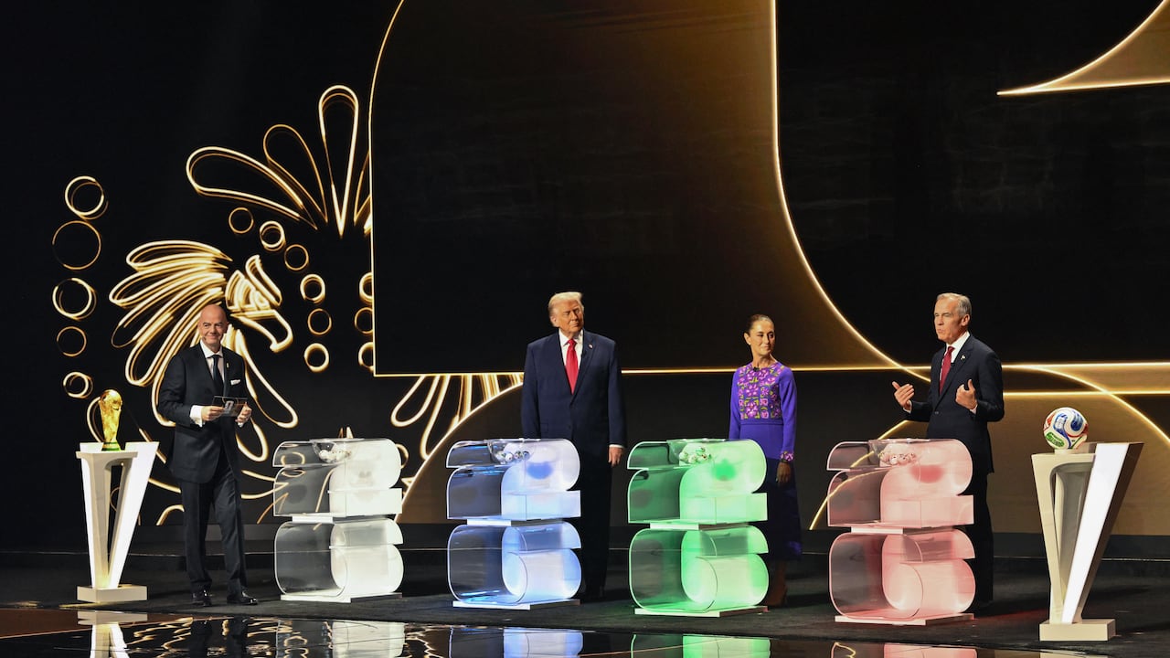 (L/R) FIFA President Gianni Infantino, US President Donald Trump, Mexico's President Claudia Sheinbaum, and Canada's Prime Minister Mark Carney stand on stage during the draw for the 2026 FIFA Football World Cup taking place in the US, Canada and Mexico, at the Kennedy Center, in Washington, DC, on December 5, 2025. (Photo by Mandel NGAN / POOL / AFP)