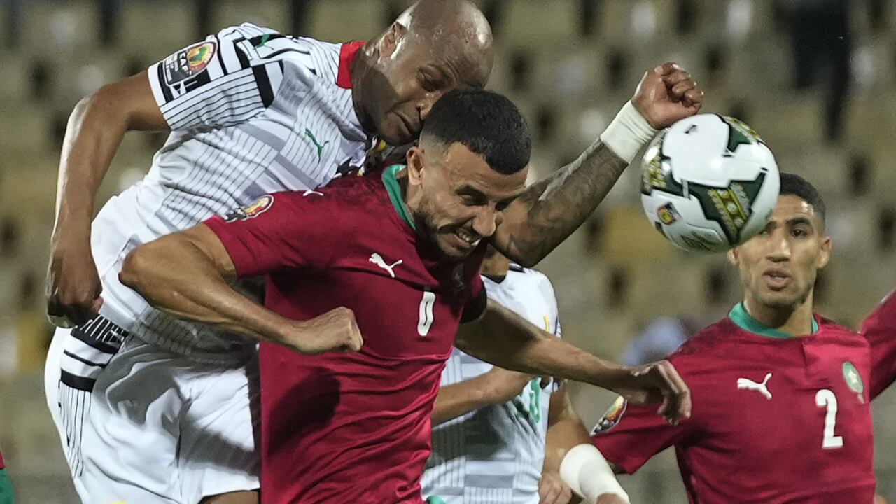 Ghana's captain Andre Ayew, top left, collides with Morocco's captain Romain Saiss during the African Cup of Nations 2022 group B soccer match between Morocco and Ghana at the Ahmadou Ahidjo stadium in Yaounde, Cameroon, Monday, Jan. 10, 2022. (AP/Themba Hadebe)