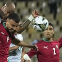 Ghana's captain Andre Ayew, top left, collides with Morocco's captain Romain Saiss during the African Cup of Nations 2022 group B soccer match between Morocco and Ghana at the Ahmadou Ahidjo stadium in Yaounde, Cameroon, Monday, Jan. 10, 2022. (AP Photo/Themba Hadebe)