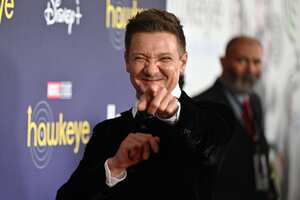 (FILES) In this file photo taken on November 17, 2021 US actor Jeremy Renner arrives for the premiere of Marvel Studios' television miniseries "Hawkeye" at the El Capitan Theatre in Los Angeles. - Movie star Jeremy Renner, known for his role as Hawkeye in several Marvel blockbusters, was in critical but stable condition following an accident while plowing snow, his representative told US media. Renner was using a truck-sized tracked snow vehicle about a quarter mile from his mountain home on January 1, 2023 when the vehicle accidentally ran over one of his legs, the TMZ tabloid news website said. (Photo by Robyn Beck / AFP)