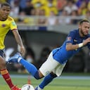 Brazil's Neymar falls, chased by Colombia's Wilmar Barrios, during a qualifying soccer match for the FIFA World Cup Qatar 2022 in Barranquilla, Colombia, Sunday, Oct. 10, 2021. (AP Photo/Fernando Vergara)