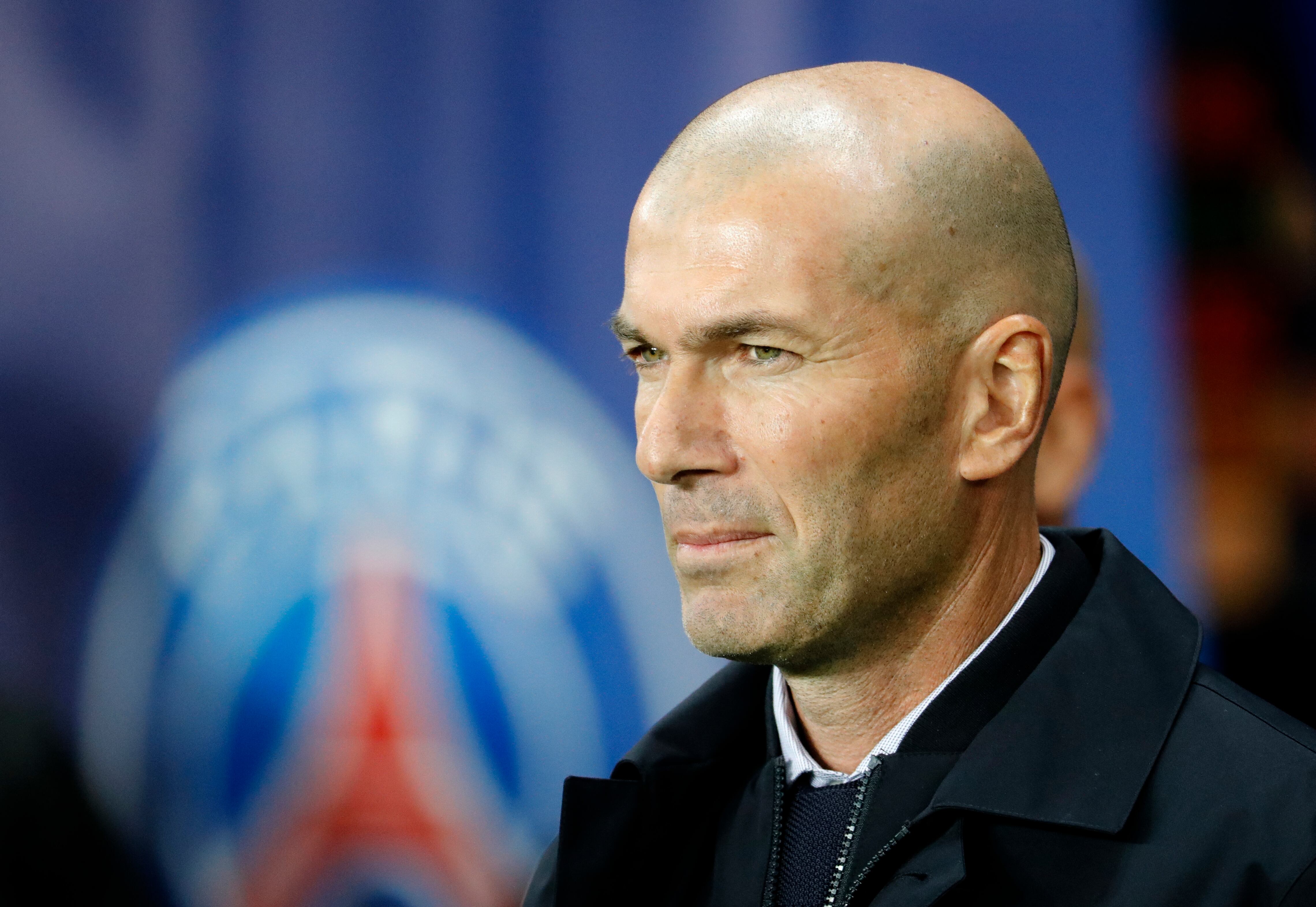 (FILES) In this file photo taken on September 18, 2019, then Real Madrid's French coach Zinedine Zidane looks on prior to the start of the UEFA Champions league Group A football match between Paris Saint-Germain and Real Madrid at the Parc des Princes stadium in Paris. - Paris Saint-Germain is close to reaching an agreement with Zidane to become the club's next coach, French Radio stations Europe 1 and RMC Sport announced on June 10, 2022. (Photo by Thomas SAMSON / AFP)