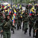 Members of military units and the Bolivarian National Guard participate in a military march and parade within the framework of military exercises called Bolivarian Shield "Supreme Commander Hugo Rafael Chavez Frias 2021," in Caracas on March 5, 2021. - Military units will develop military exercises from March 5 to 7. (Photo by Yuri CORTEZ / AFP)