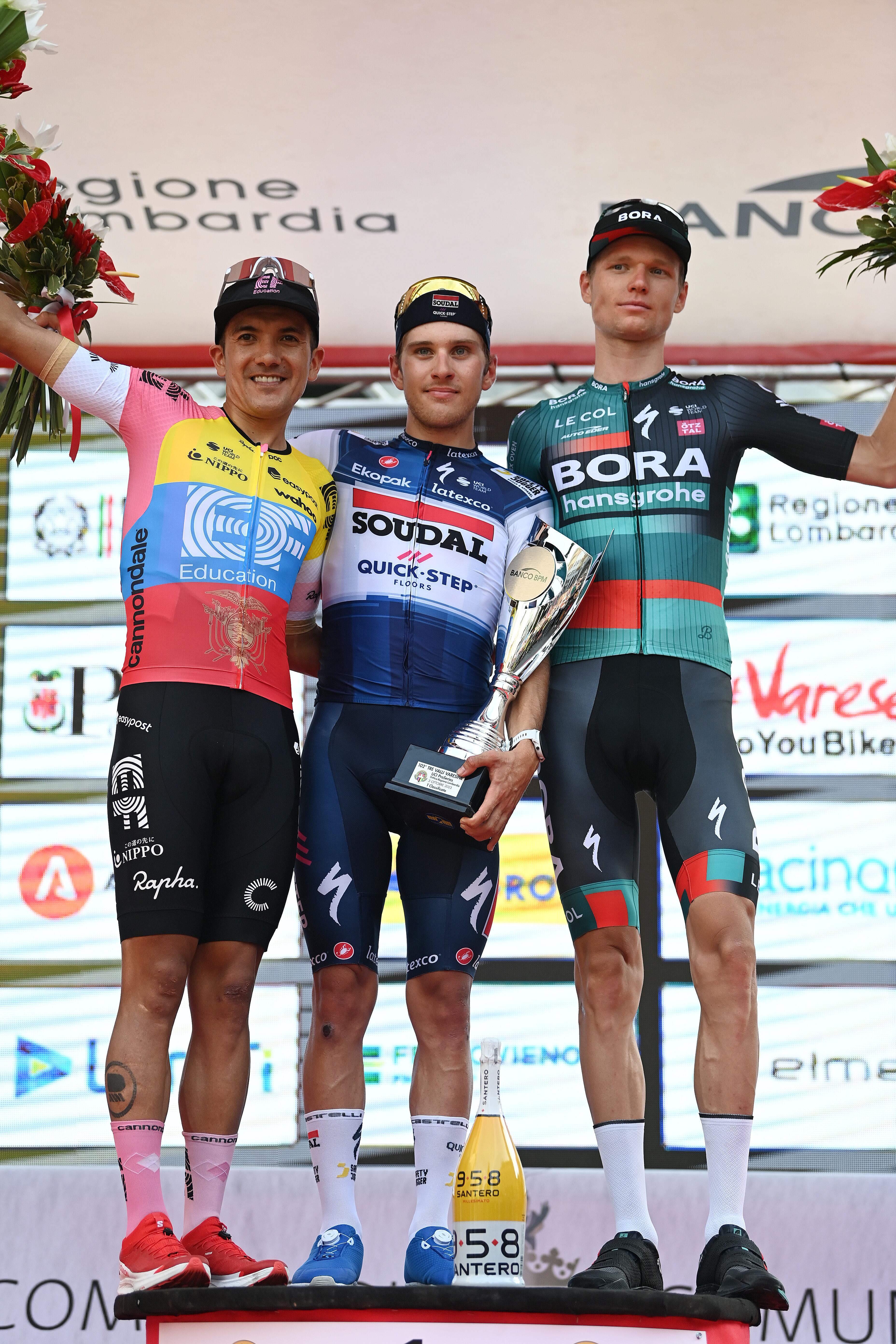 VARESE, ITALY - OCTOBER 03: (L-R) Richard Carapaz of Ecuador and EF Education-EasyPost on second place, race winner Ilan Van Wilder of Belgium and Team Soudal - Quick Step and Aleksandr Vlasov of Russia and Team BORA - hansgrohe on third place pose on the podium ceremony after the 102nd Tre Valli Varesine 2023 a 196.54km one day race from Busto Arsizio to Varese on October 03, 2023 in Varese, Italy. (Photo by Tim de Waele/Getty Images)