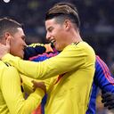 PARIS, FRANCE - MARCH 23: Juan Fernando Quintero of Colombia is congratulated by teammate James Rodriguez after scoring during the international friendly match between France and Colombia at Stade de France on March 23, 2018 in Paris, France. (Photo by Aurelien Meunier/Getty Images)