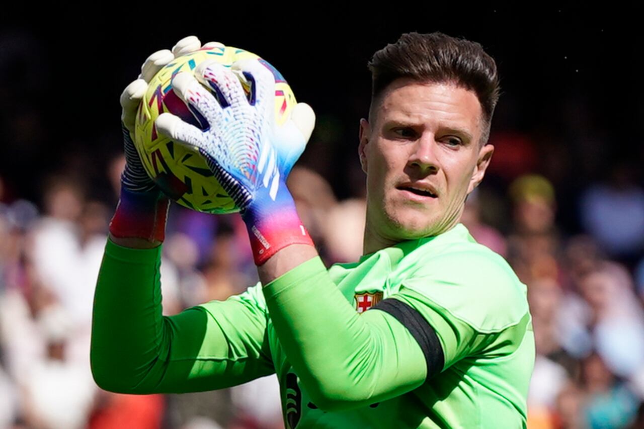 Barcelona's goalkeeper Marc-Andre ter Stegen makes a save during a Spanish La Liga soccer match between Barcelona and Atletico Madrid, at the Camp Nou stadium in Barcelona, Spain, Sunday, April 23, 2023. (AP Photo/Joan Mateu)