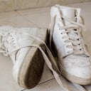 White dirty sneakers on the floor