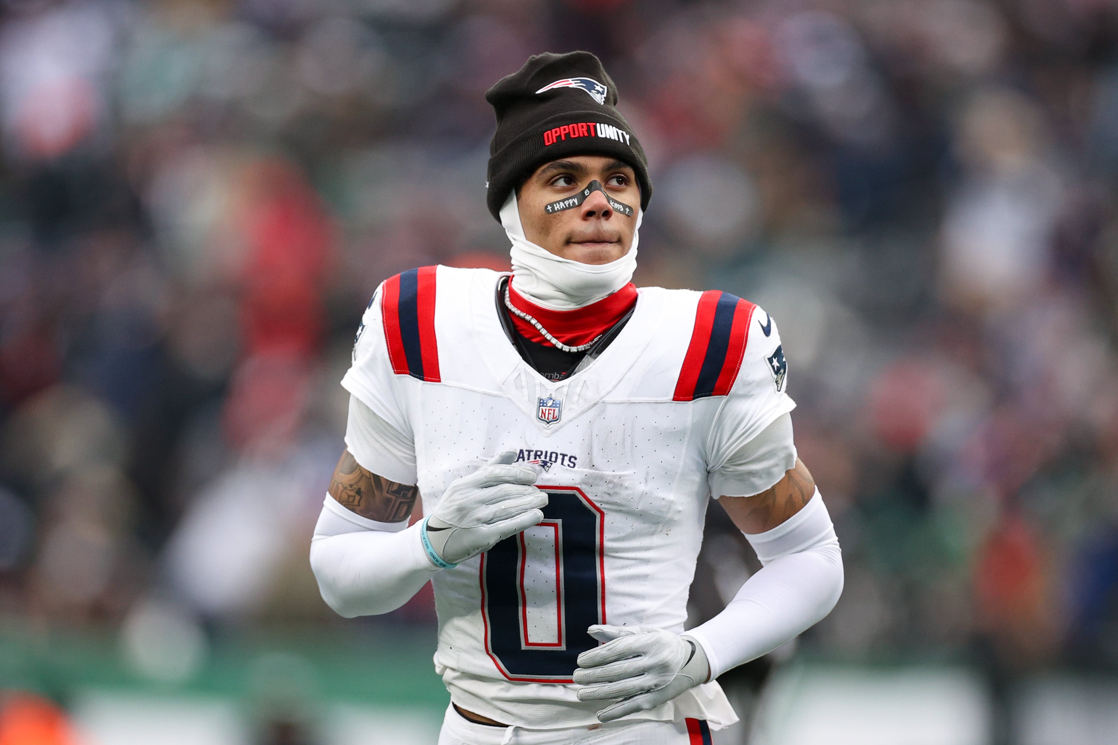 EAST RUTHERFORD, NEW JERSEY - DECEMBER 28: Christian Gonzalez #0 of the New England Patriots looks on during the game against the New York Jets at MetLife Stadium on December 28, 2025 in East Rutherford, New Jersey. (Photo by Evan Bernstein/Getty Images)