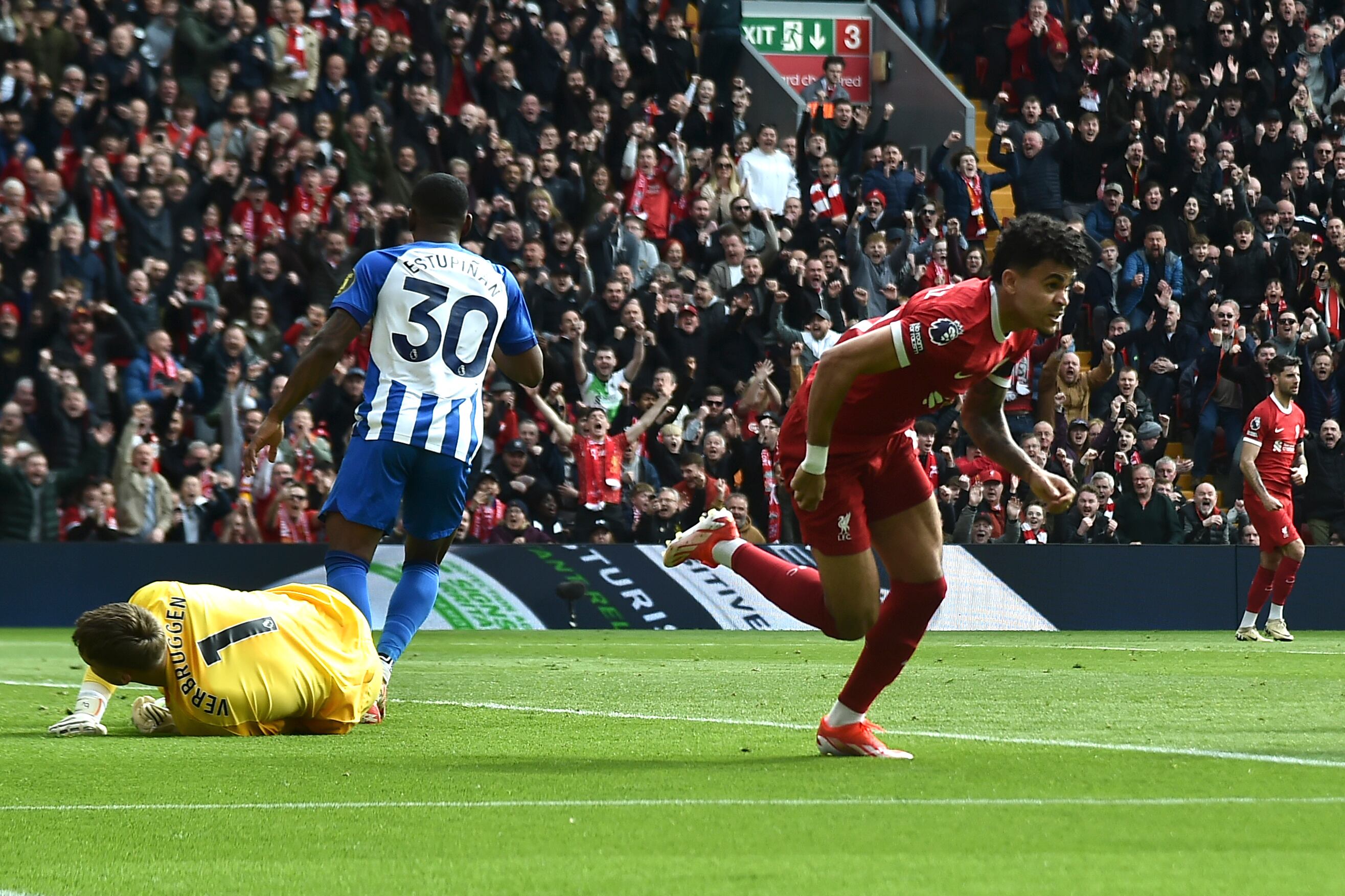 Liverpool's Luis Diaz, right, celebrates after scoring his side's opening goal during the English Premier League soccer match between Liverpool and Brighton and Hove at Anfield Stadium in Liverpool, England, Sunday, March 31, 2024. (AP Photo/Rui Vieira)