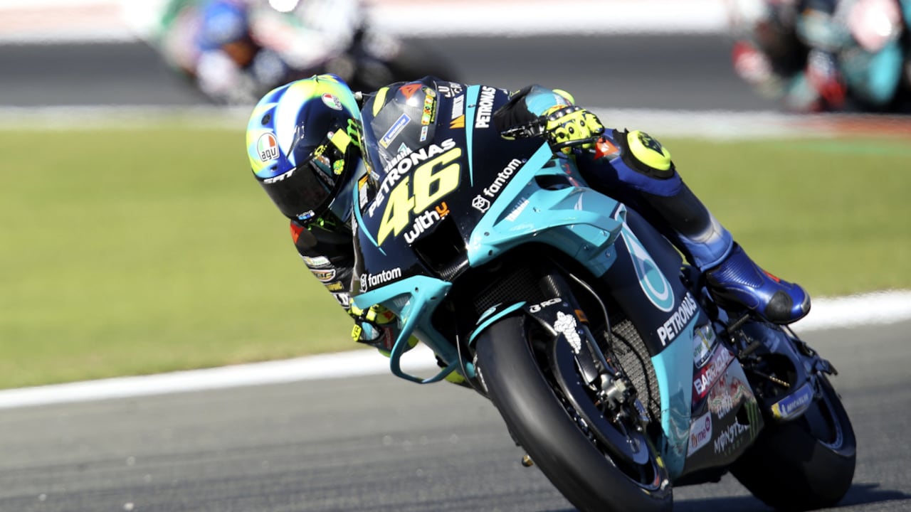MotoGP rider Valentino Rossi of Italy steers his motorcycle during the Valencia Motorcycle Grand Prix, the last race of the season, at the Ricardo Tormo circuit in Cheste, near Valencia, Spain, Sunday, Nov. 14, 2021. Rossi will be retiring from MotoGP racing as the season ends in Valencia. (AP/Alberto Saiz)