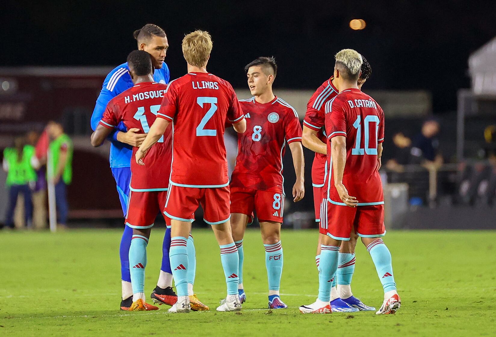 Colombia's players celebrate their win at the end of the friendly football match between Colombia and Venezuela at the DRV PNK Stadium in Fort Lauderdale, Florida, December 10, 2023. (Photo by Chris Arjoon / AFP)