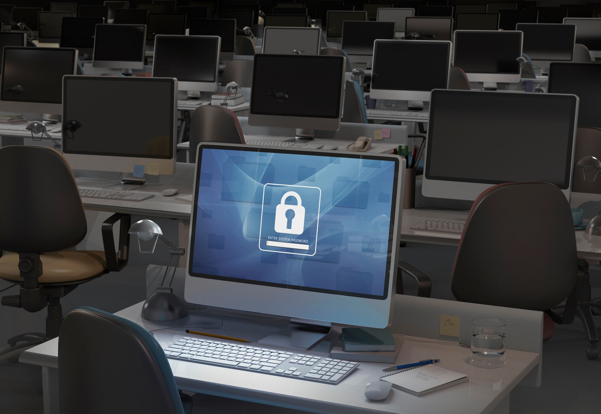 Computadora en oficina oscura, se requiere ingreso de contraseña - Imagen de referencia