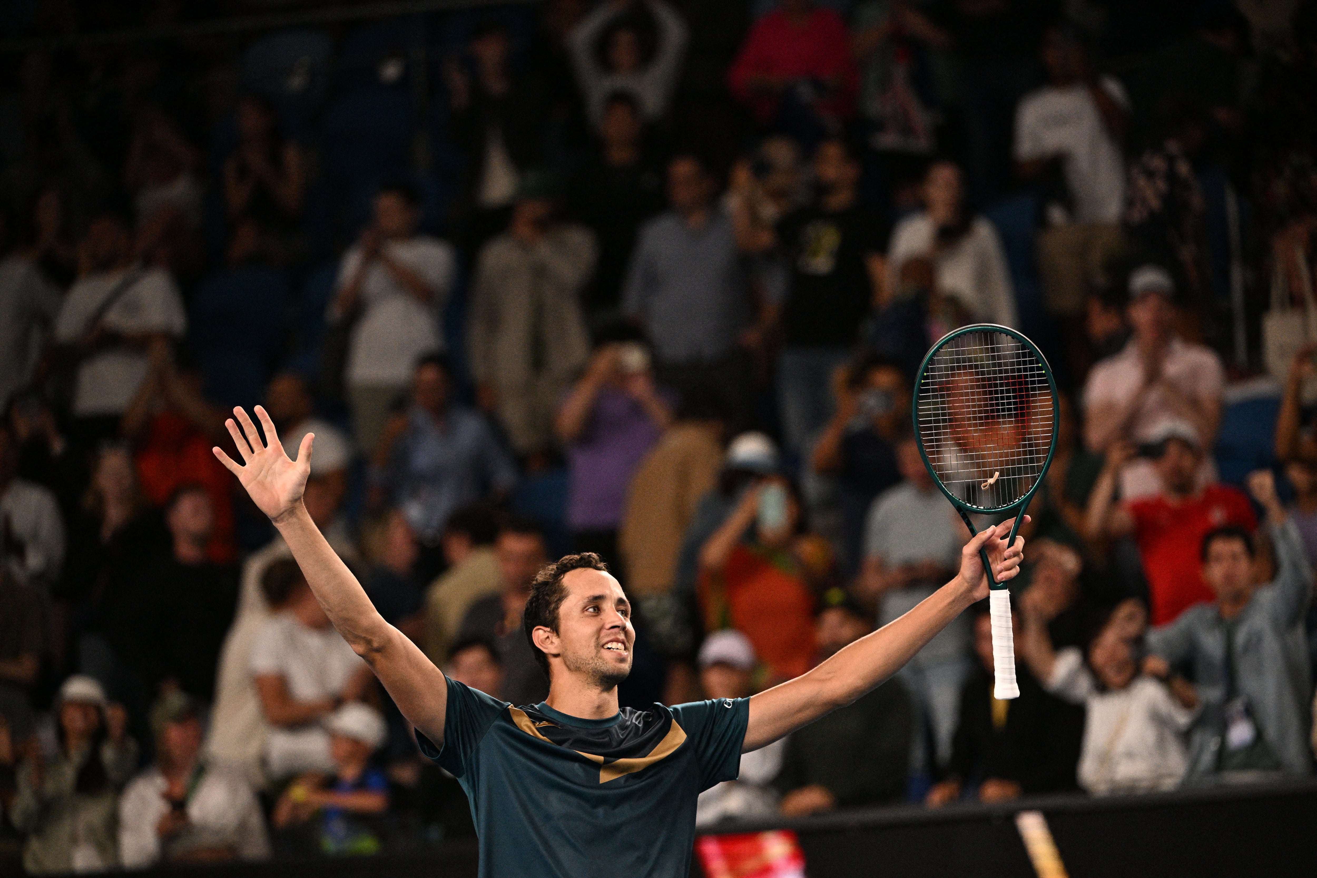 Colombia's Daniel Galan celebrates victory over Australia's Jason Kubler in their men's singles match on day one of the Australian Open tennis tournament in Melbourne on January 14, 2024. (Photo by Anthony WALLACE / AFP) / -- IMAGE RESTRICTED TO EDITORIAL USE - STRICTLY NO COMMERCIAL USE --