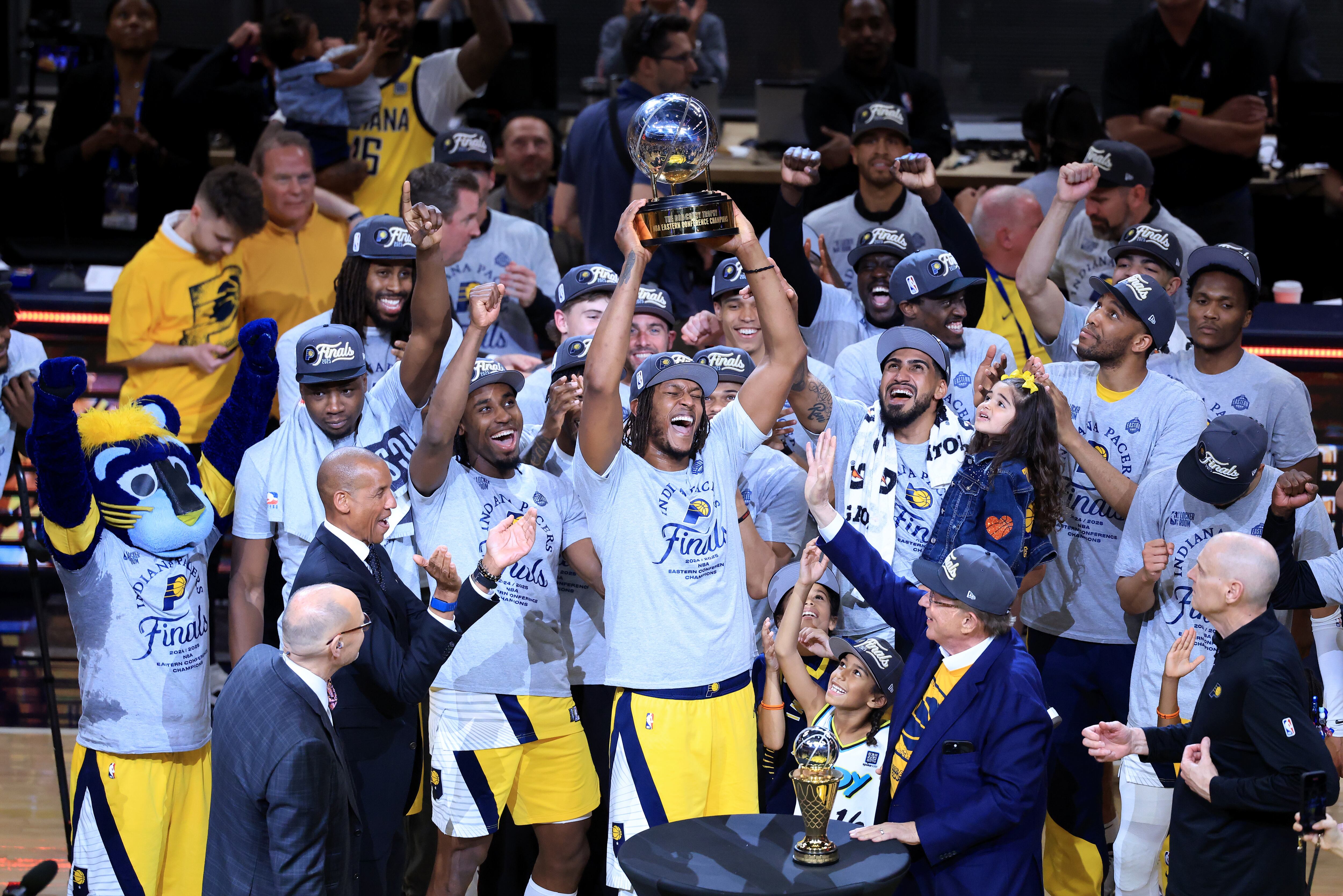 INDIANAPOLIS, INDIANA - MAY 31: Myles Turner #33 of the Indiana Pacers celebrates with the Bob Cousy Trophy after the 125-108 win against the New York Knicks in Game Six of the Eastern Conference Finals of the 2025 NBA Playoffs at Gainbridge Fieldhouse on May 31, 2025 in Indianapolis, Indiana. NOTE TO USER: User expressly acknowledges and agrees that, by downloading and or using this photograph, User is consenting to the terms and conditions of the Getty Images License Agreement. (Photo by Justin Casterline/Getty Images)