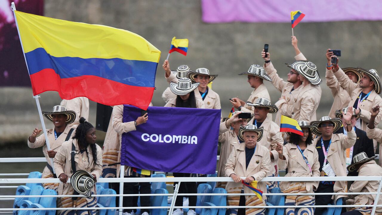 Athletes of Colombia aboard a boat as it makes its way along the Seine in Paris, France, during the opening ceremony for the 2024 Summer Olympics, Friday, July 26, 2024. (Ann Wang/Pool Photo via AP)