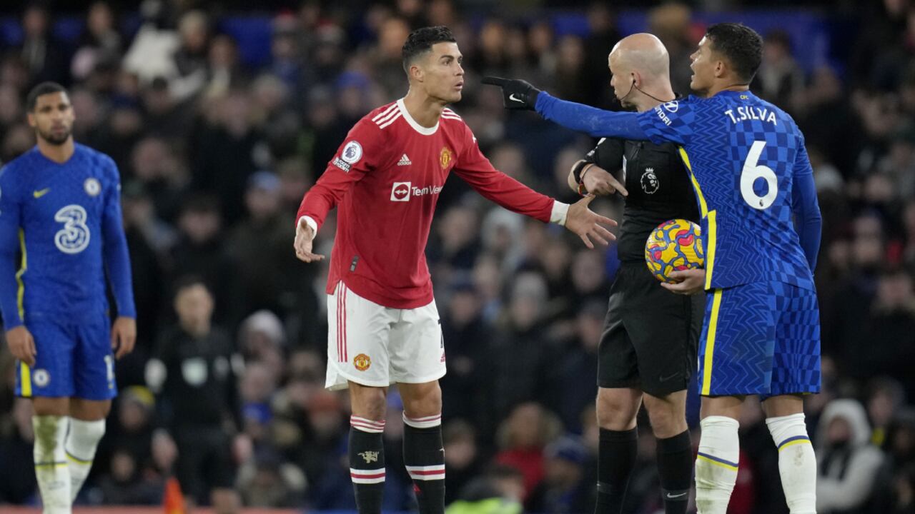 Manchester United's Cristiano Ronaldo talks to Referee Anthony Taylor while Chelsea's Thiago Silva, right, gestures during the English Premier League soccer match between Chelsea and Manchester United at Stamford Bridge stadium in London, Sunday, Nov. 28, 2021. (AP/Kirsty Wigglesworth)