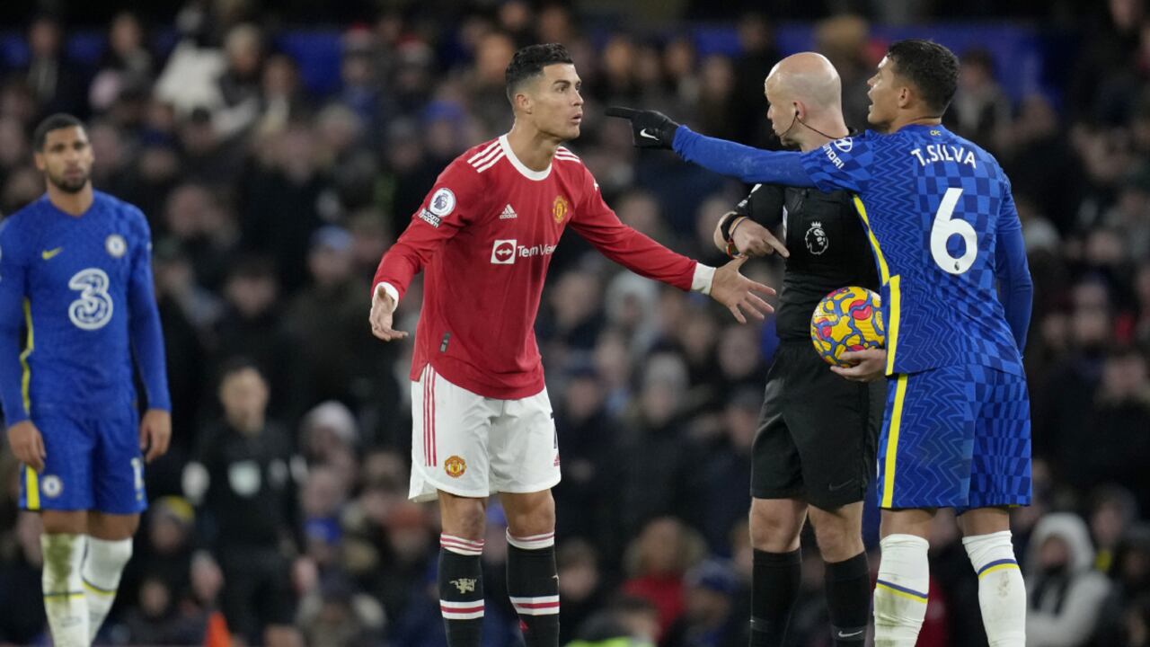 Manchester United's Cristiano Ronaldo talks to Referee Anthony Taylor while Chelsea's Thiago Silva, right, gestures during the English Premier League soccer match between Chelsea and Manchester United at Stamford Bridge stadium in London, Sunday, Nov. 28, 2021. (AP/Kirsty Wigglesworth)