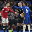 Manchester United's Cristiano Ronaldo talks to Referee Anthony Taylor while Chelsea's Thiago Silva, right, gestures during the English Premier League soccer match between Chelsea and Manchester United at Stamford Bridge stadium in London, Sunday, Nov. 28, 2021. (AP Photo/Kirsty Wigglesworth)